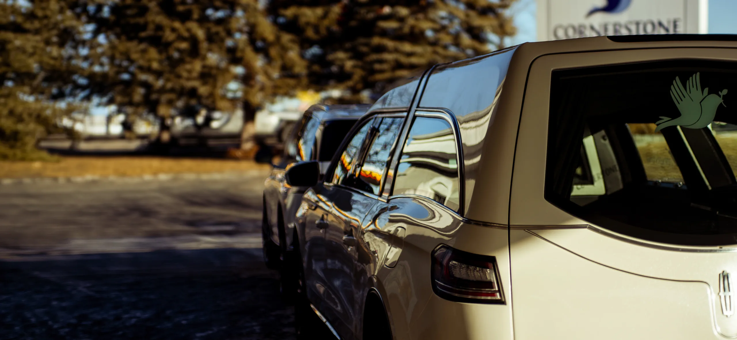 Cornerstone Funeral Home's fleet outside the building, as featured on its website